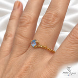 Bijou Bague articulée en or jaune 18 carats avec saphir bleu clair joaillerie legros bijouterie