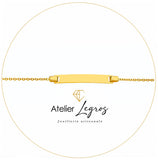 Bijou Gourmette bébé en or jaune 18 carats bracelet prénom maille forçat ronde plaque rectangulaire 14 cm joaillerie legros bijouterie
