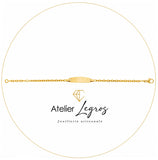 Bijou Gourmette bébé en or jaune 18 carats bracelet prénom plaque ovale maille forçat diamantée joaillerie legros bijouterie